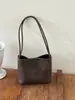 Bolso de axila de nicho de alta gama para mujer, nuevo modelo de verano 2026, bolso de cubo de axila de un solo hombro súper popular y exquisito
