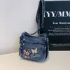 Bolsa Quadrada Pequena Minimalista Fashion e Única Modelo Novo Verão 2026 Porta-Moedas e Celular Bolsa Transversal de Brim Bordada de Alto Valor