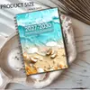 Planificador Mensual Espiral con Vista al Mar y la Playa 2027-2030 Cuaderno de Planificación de Cuatro Años para Comercio Exterior Transfronterizo