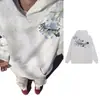 Novo design americano de streetwear estilo Harajuku, apresentando um moletom com capuz estampado para homens e mulheres, um top/jaqueta solto e casual para outono e inverno.