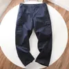 Pantalones cargo anchos unisex de moda casual estilo Harajuku para otoño, con múltiples bolsillos y puños tipo jogger, modernos