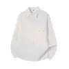 Camisa con textura G-stone para hombre con diseño de bolsillo con solapa, corte simple y holgado, top casual de manga larga para jóvenes