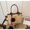 Bolso de mano retro simple transfronterizo bolso pequeño para mujer nuevo elegante diseño de nicho bolso cubo versátil bolso de hombro único bandolera