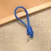 Bolsa de Corda de Couro PU Colorida Pingente Estilo Miu Simples Versátil Charme de Bolsa Chaveiro Acessório Lanyard de Celular Estilo Curto Novo