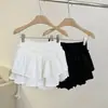 Verano 2025 Nueva Falda Corta Abullonada Estilo Pastel Anti-Exposición de Cintura Alta para Mujeres Petites Blanca