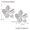 Pendientes de flores exageradas de acero inoxidable populares de Enigma Europa y América, pendientes de flores pequeñas personalizados de lujo ligeros de moda francesa para mujer