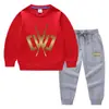 Ropa infantil transfronteriza nueva Otoño e Invierno 2023 suéter para niños pantalones traje de dos piezas color liso bebé algodón manga larga