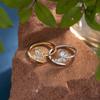 Anillo de pareja al por mayor, joyería ligera de lujo de alta gama para mujer, anillo de boca suelta asimétrico sin color para hombre, combina con todo.