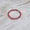 Venta al por mayor de fábrica flor de durazno infusión esmalte de color tarjeta sonajero 6 audaz estilo nacional temperamento jade artificial libro rojo pequeño explosiones amigas