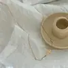 Collar de acero de titanio chapado en oro de lujo ligero y sin decoloración, cadena de clavícula con lazo de moda versátil para mujer, fabricantes