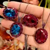 2026 Nueva Joyería Zhuangshengsheng Corindón Rojo Simulado Espinela Azul Oro Negro Colgante Ovalado Conjunto Piedra Principal 13*18