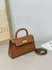 Elegante bolsa Kelly com fivela de prata e padrão manual 2026 nova moda feminina bolsa de mão de segunda geração com fivela dourada, bolsa de ombro e transversal