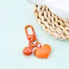 Nuevo Estilo Cortado Cara Amor Llavero Colgante Color Caramelo Campana Accesorios DIY Bolso de Pareja Auriculares Colgante Accesorios