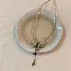 Novo colar com pingente de borboleta e borla de caligrafia chinesa feminino design de nicho senso de design estilo nacional corrente para clavícula colar frio e claro