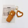 Bolsa de Maquiagem Chaveiro em Formato de Coração Mais Vendida em Estoque, Mini Bolsa Exquisita Criativa e Fashionável Pingente de Bolsa Portátil