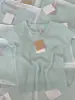 Camiseta de Verano para Mujer Estilo Fresco Verde con Agujeros, Estilo Chica Hot, Tejido Delgado de Seda de Hielo, Hombro Descubierto, Cuello Redondo, Manga Corta