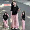 Ropa de otoño para niños 2026 nuevos atuendos elegantes para niños mayores, conjunto de camisetas únicas y modernas de manga larga para niñas en otoño
