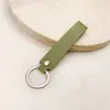 Chaveiro de Couro Versátil de Cor Sólida, Alça de Pulso para Bolsa, Pingente de Boneca, Cordão de Moda para Chaveiro de Carro de Casal, Acessórios