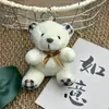 Oso de Peluche Pajarita Colgante Muñeca Pequeña Muñeco de Peluche Muñeca de Tiro Muñeca Regalo