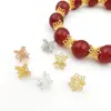 Accesorios para joyería DIY chapados en oro de alta retención de color, colgante de flor de loto hueco de doble cara, materiales para pulseras y collares de cuentas hechos a mano