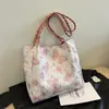 Nuevo bolso de hombro casual de gran capacidad para principios de otoño de 2026, diseño de mariposa, adecuado para estudiantes universitarios, para ir a clase, mochila tote, venta al por mayor