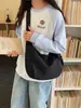Bolsa de tela de gran capacidad para niñas, nueva bolsa de hombro cruzada de diseño casual niche estilo coreano, bolsa de albóndiga de alta gama