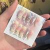 Qiaoyi lujo ligero simple uso tarjeta de uñas tarjeta de uñas exhibición fondo diseño de cartón empaque de almacenamiento de piezas de uñas al por mayor