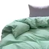 Conjunto de tres piezas estilo blogger con bloques de color para dormitorio estudiantil, conjunto de cuatro piezas de gasa fruncida a rayas de algodón puro, sábana de algodón lavado