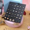 Europa y Estados Unidos joyería transfronteriza al por mayor juego de aretes moda femenina metal amor perla trébol de cuatro hojas aleación aretes aretes
