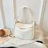 Bolso de mano de diseño de nicho a la moda para mujer, nuevo bolso de verano 2026 versión coreana para llevar debajo del brazo, bolso de hombro cruzado para el trabajo, moderno