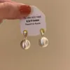 Pendientes de Botón Redondos de Plata Cepillada Mate Estilo Único de Nicho 2025 Nuevos Pendientes Populares de Otoño e Invierno con un Toque de Lujo Ligero y de Alta Gama