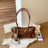 Bolso bandolera de gran capacidad para baguette con cinturón, textura vintage, piel de cera de aceite, color sólido, moda de primavera 2026 nuevo para mujer