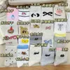 Calcetines de tobillo medio estilo chica japonesa, lindos, versátiles, con lazo de dibujos animados, lunares, blancos, ins, colección Otoño 2026