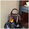 Bolsa de Mão Super Quente Almofada Bowling Feminina 2025 Nova Outono/Inverno Toque de Luxo Leve Nicho Bolsa Transversal