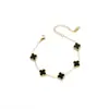 Popular Transfronteiriço Dupla Face Trevo da Sorte de Quatro Folhas Aço Titânio Ouro 18K Simples Moda Versátil Pulseira Feminina Pronta Entrega Atacado