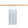 Colgador de ropa multifuncional de nueve agujeros para almacenamiento en el hogar, soporte para armario, popular colgador mágico giratorio retráctil plegable de nueve agujeros