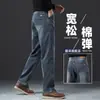Jeans negros de alta gama para hombre, estilo otoño e invierno, rectos anchos holgados, talla grande, casual, elásticos, con bolsillos laterales, pantalones largos