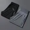 Pantalones de Malla Transpirable de Seda Helada Nuevos de Verano para Hombre Pantalones Elásticos de Secado Rápido para Hombre Talla Grande Casual de Nueve Puntos Pantalones de Aire Acondicionado para Hombre