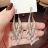 Brincos de Franja Gota de Água em Vidro Agulha de Prata Brincos Boêmios de Luxo Leve Brincos de Temperamento Niche High-End Atacado para Mulheres