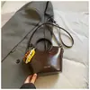 Bolsas Exquisitas de Nicho para Mujer 2026 Nuevo Modelo Bolso de Hombro Cruzado Versátil de Gama Alta Bolso de Mano Simple Súper Popular