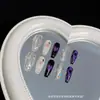 Pó de espelho mágico roxo blush em formato de coração pele amarela e preta unhas postiças super brilhantes y2k toque de luxo parecido com fada toque de luxo nicho camiseta longa