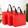 Bolsa não tecida festiva vermelha, bolsa de compras de loja de roupas de alta qualidade, bolsa de compras dobrável ecológica para presente de Ano Novo, feita sob medida
