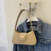 Bolso de axila de nicho estilo francés 2026 nuevo modelo bolso de mano simple bolso de hombro de moda bolso cruzado bolso pequeño para mujer