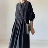 Exportación Ropa de Mujer Japonesa y Coreana Primavera y Otoño Explosiones Cuello Redondo Hebilla Manga Larga Vestido Color Liso Simple Conocimiento Vestido Largo Negro para Mujer