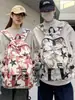 Mochila moderna con graffiti para hombre, adecuada para estudiantes de secundaria, preparatoria y universidad; Mochila de viaje elegante de gran capacidad para mujer