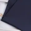 Shaoxing Fabricantes Venta al por mayor en stock Tela Shaka Trajes de Moda Ropa Casual Ropa de Trabajo Pantalones Tela