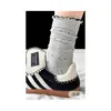 Calcetines largos a rayas y de lunares, modernos, dulces y lindos, para estudiantes, estilo coreano, perfectos para otoño e invierno, con etiqueta de tela y longitud hasta la mitad de la pantorrilla.