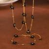 Joyería de estilo británico retro nicho personalidad simple versátil piedra natural con cuentas forma de flor traje de joyería de acero de titanio