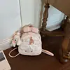 Mochila pequeña de encaje estilo coreano de nicho con orejas largas de conejo dulce de alta apariencia, mochila de viaje nueva y moderna estilo japonés y coreano para mujer