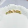 Anillo de Cobre Chapado en Oro de 18 Quilates Alta Retención de Color Circonio Completo Cierre de Extensión Accesorios para Joyería DIY Venta al Por Mayor desde Fabricante